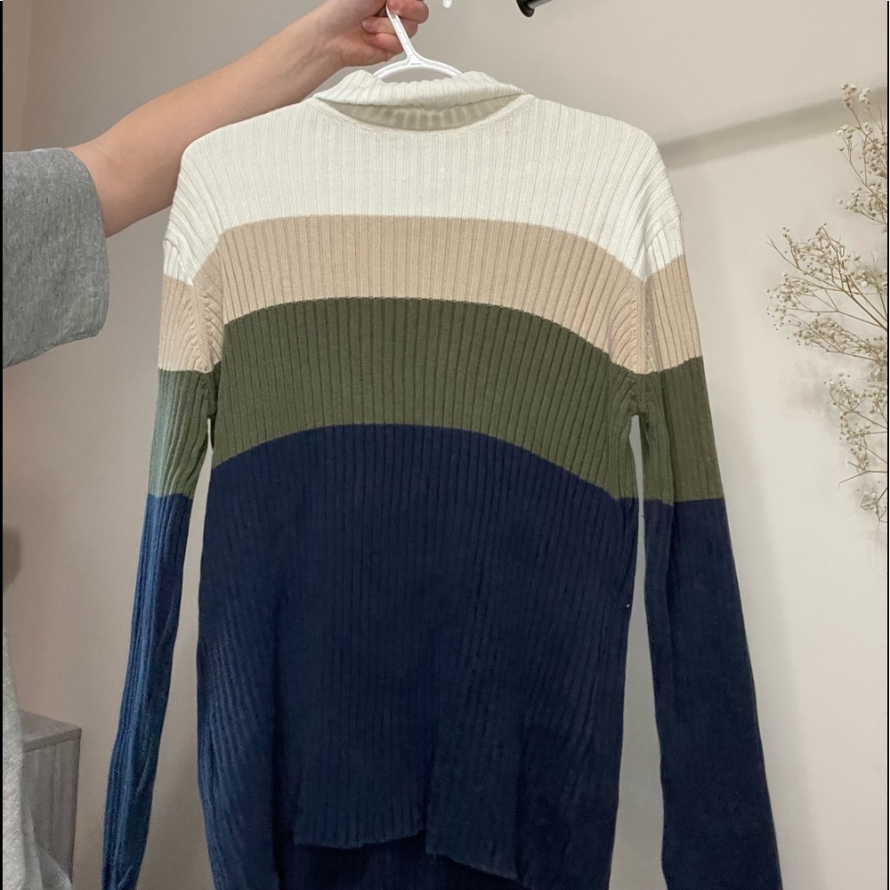White, green, and blue knitted sweater